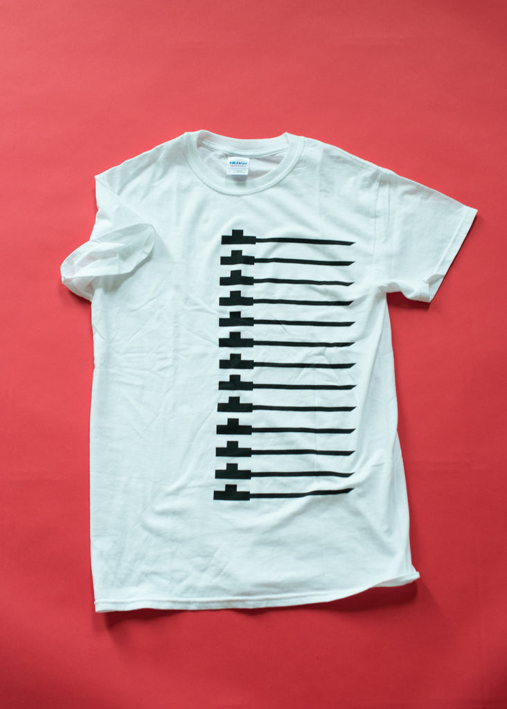 Traditional pipe design on white soft cotton t-shirt. Black on white.