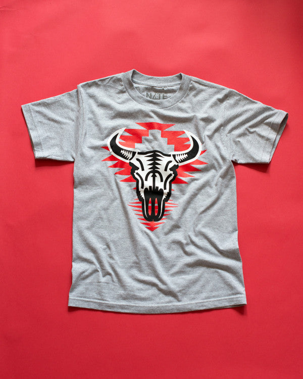 Unisex t-shirt with screenprinted black and white design of a buffalo on red geometric pattern on a grey cotton t-shirt.