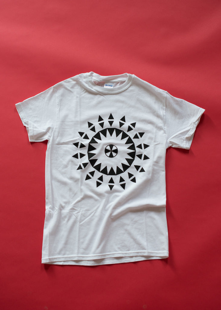Geometric aboriginal medallion design on soft white cotton t-shirt. Black and white.